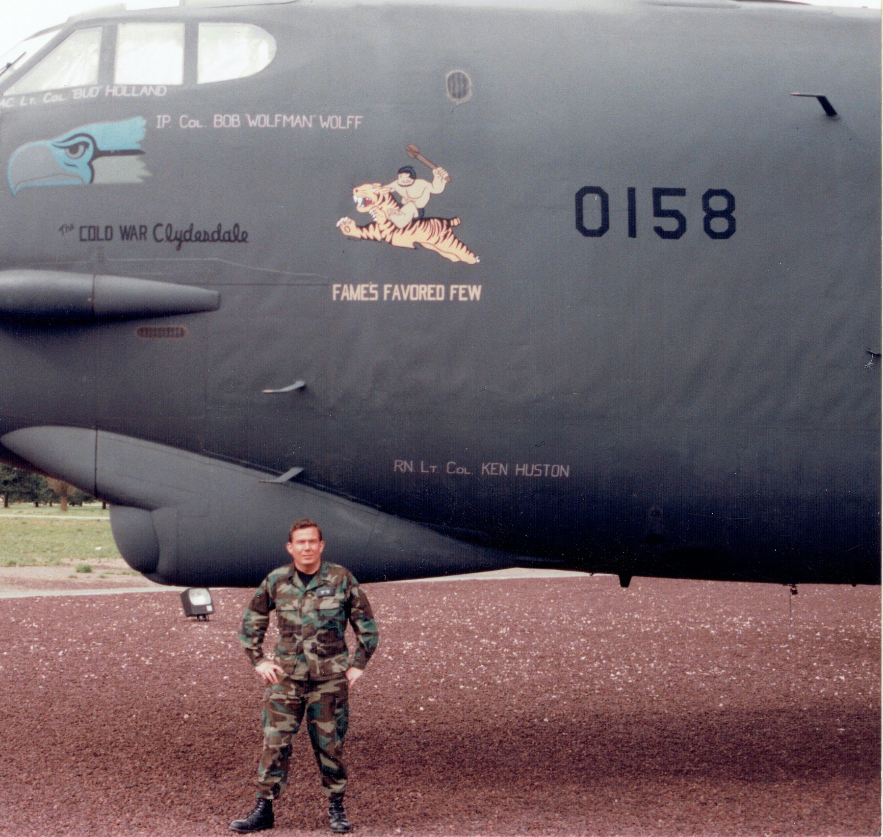 Captain Terry L. Fossum standing before a B-52 bomber at Fairchild Air Force Base