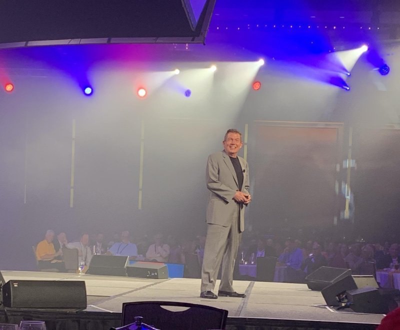 Terry L. Fossum delivering a keynote on a large stage
