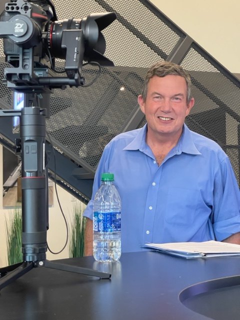 Terry L. Fossum on set beside a camera rig for the program Made in America, which he hosted