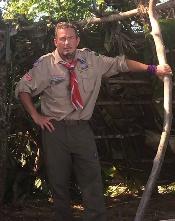 Terry L. Fossum beside a jungle survival shelter on Fox’s Kicking & Screaming