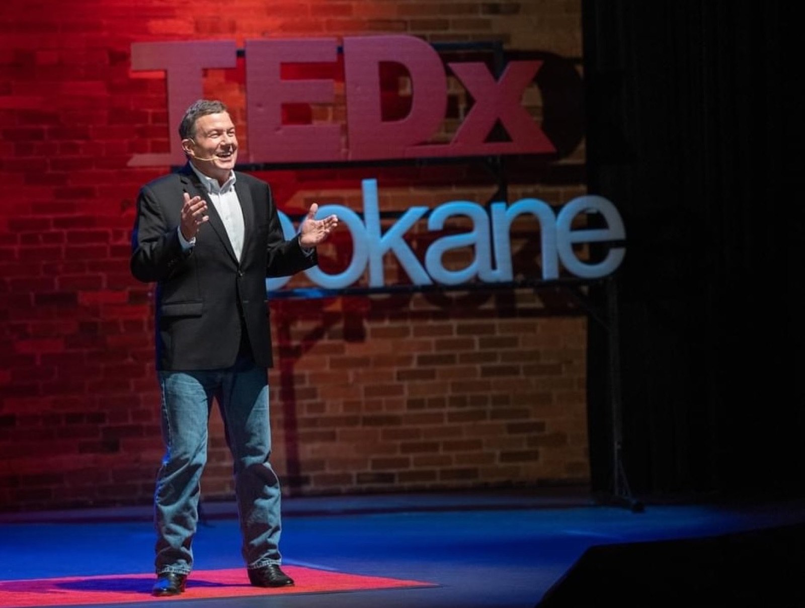 Terry L. Fossum delivering his TEDx talk on the TEDxSpokane stage