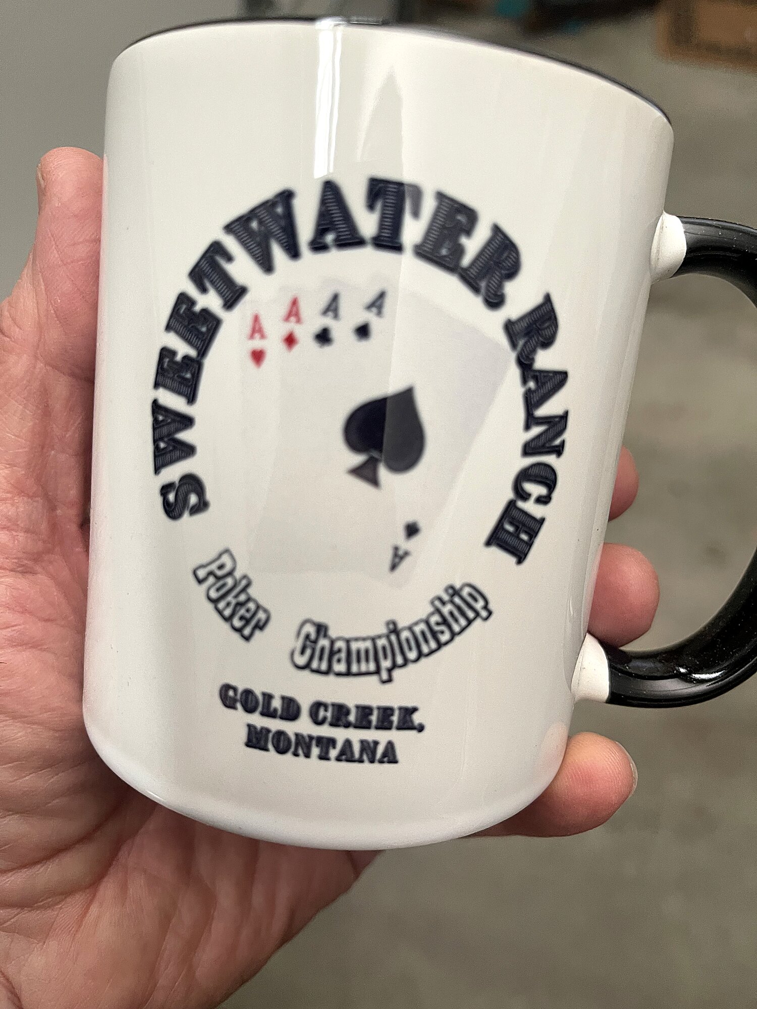 A Sweetwater Ranch Poker Championship mug, Gold Creek, Montana