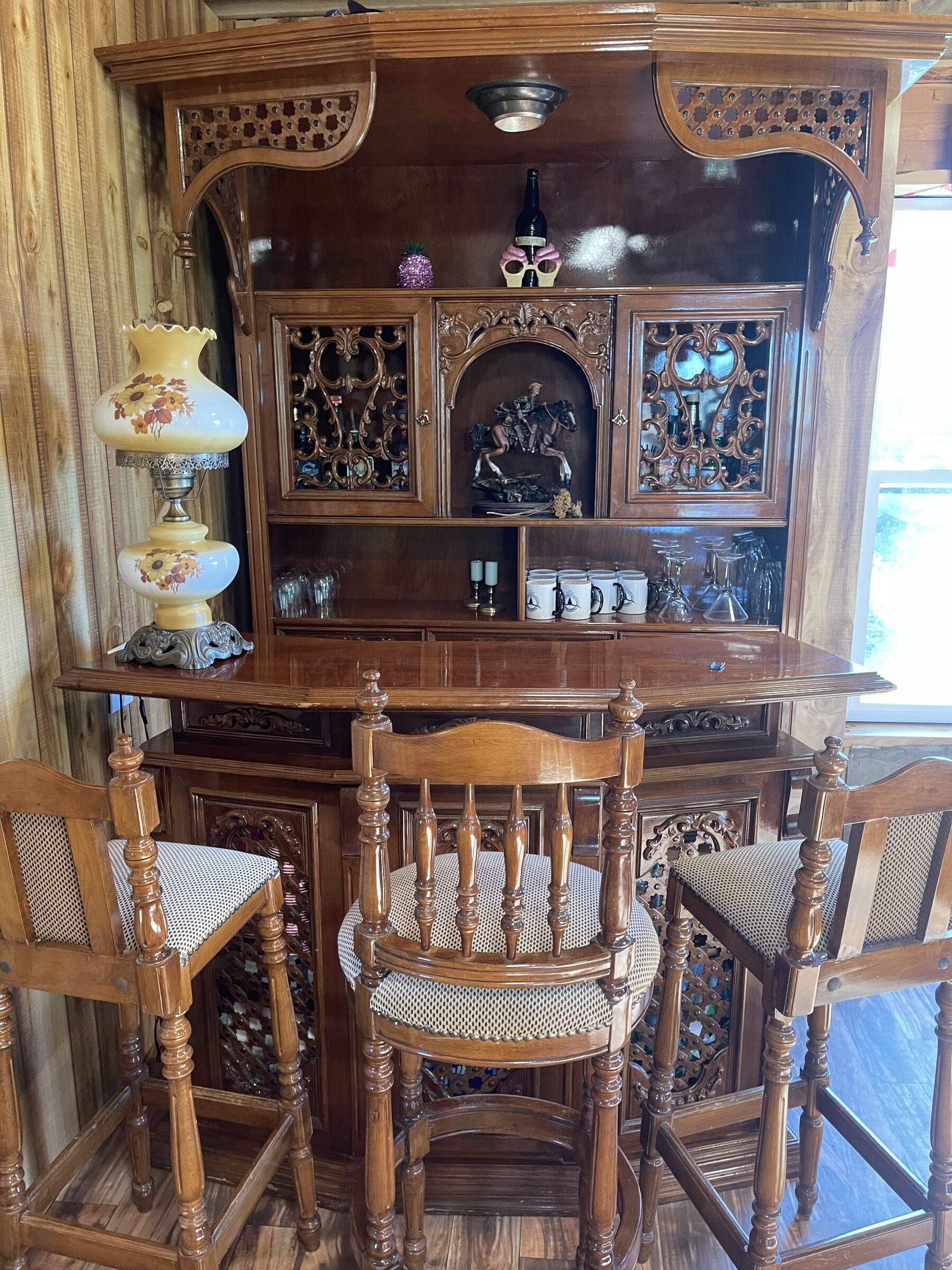 The ornately carved bar inside the Whiskey Ridge Saloon at Sweetwater Ranch